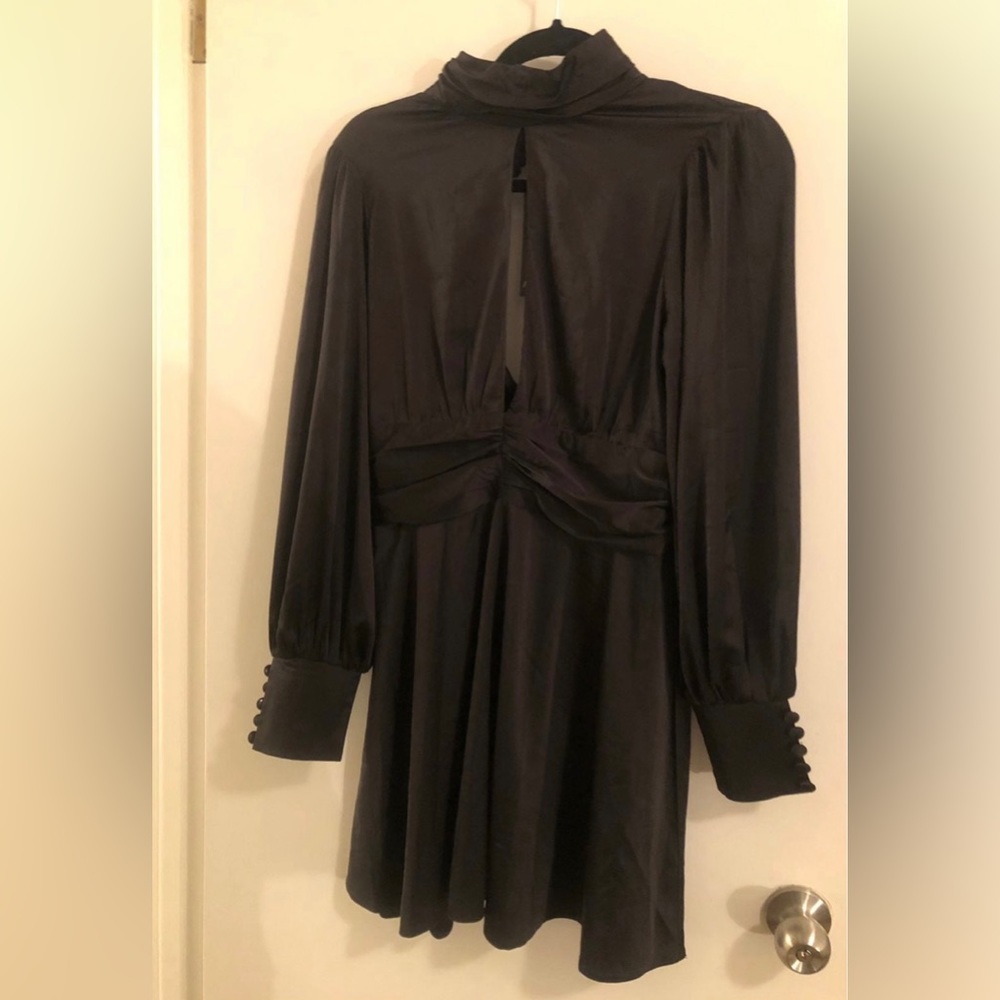 Black silky dress size 12, never been used. Brand is Nasty Gal